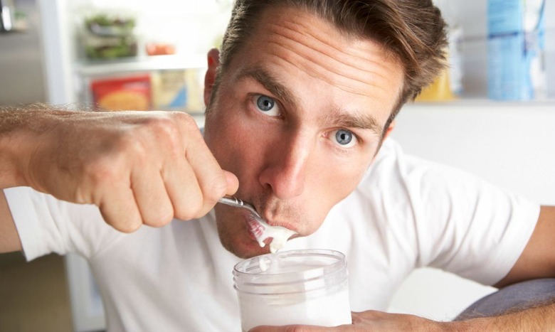 man eating yogurt